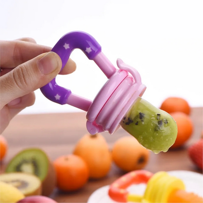 Introducing our innovative baby fruit feeder pacifier! Keep your little one happy and healthy with this safe feeding solution. The image showcases the pacifier filled with fresh fruit chunks, designed to introduce solid foods to infants while minimizing choking hazards. Trust in our quality product to make feeding time a breeze. Shop now for a stress-free feeding experience!