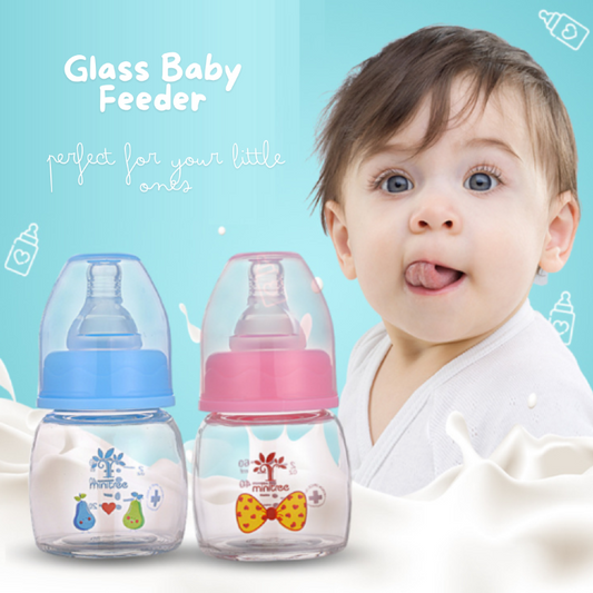 Discover the Minitree Cute Glass Baby Feeder with Regular-Neck, made from BPA-free glass and featuring non-toxic, environmentally-friendly printing ink. With a 60ml capacity, this feeder is safe for high-temperature disinfection. Available in adorable sky blue and baby pink colors. Buy now from babyfairy.pk.