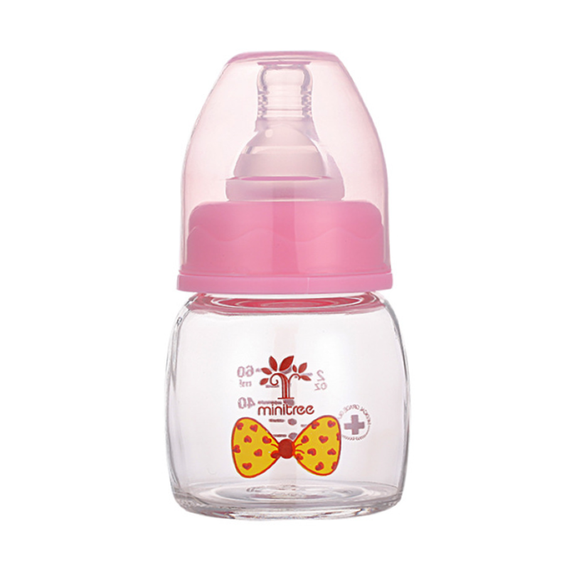 Discover the Minitree Cute Glass Baby Feeder with Regular-Neck, made from BPA-free glass and featuring non-toxic, environmentally-friendly printing ink. With a 60ml capacity, this feeder is safe for high-temperature disinfection. Available in adorable sky blue and baby pink colors. Buy now from babyfairy.pk.