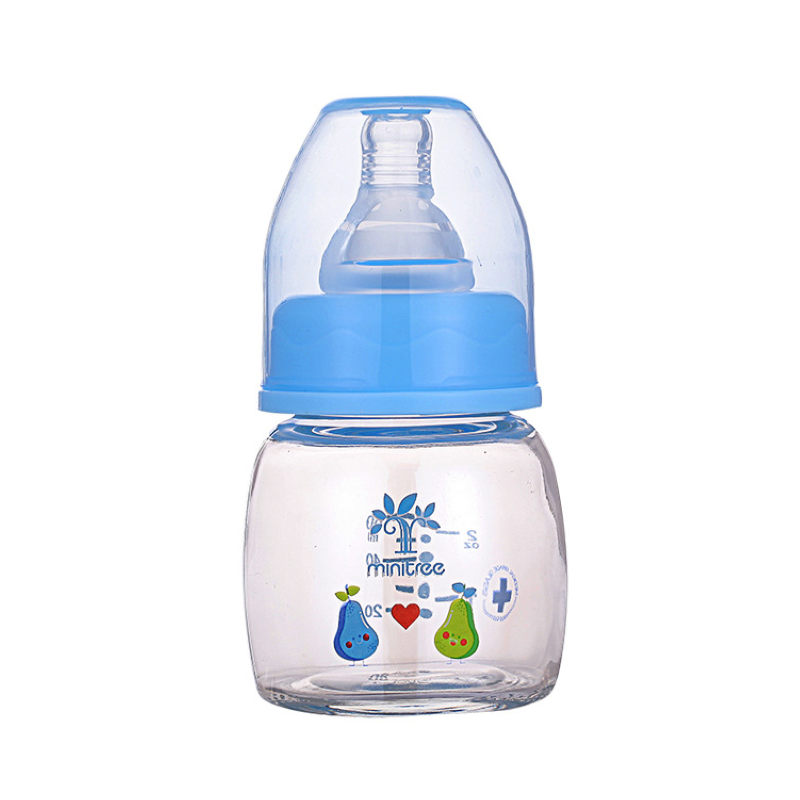 Discover the Minitree Cute Glass Baby Feeder with Regular-Neck, made from BPA-free glass and featuring non-toxic, environmentally-friendly printing ink. With a 60ml capacity, this feeder is safe for high-temperature disinfection. Available in adorable sky blue and baby pink colors. Buy now from babyfairy.pk.